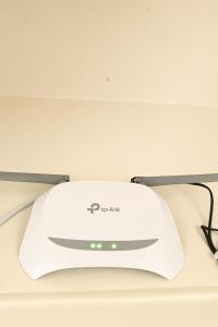 a white computer mouse on a stand on a table at Ac Bed with breakfast At ovale naka ghodbunder road thane west in Thane