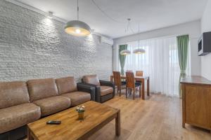 Un televizor și/sau centru de divertisment la Citadel Hideaway
