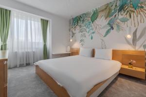 Un pat sau paturi într-o cameră la Citadel Hideaway