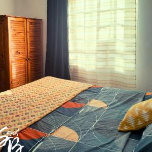 Ένα ή περισσότερα κρεβάτια σε δωμάτιο στο Lakaz Metiss Arobaz