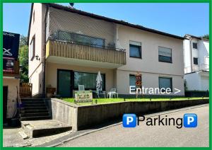 a house with a balcony on the side of it at Multi Room P2, 2-3 beds, 15qm, Check-in 4PM till 5AM in Creglingen