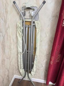 a fire extinguisher is hanging on a wall at Аэропорт Мечеть ЭКСПО in Astana