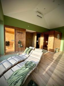 a large bedroom with four beds in a room at Puszta Farm from 6 Pers in Fülöpháza +45 photos