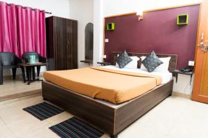 เตียงในห้องที่ Bliss Holiday In +23 ภาพ
