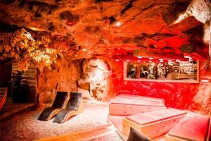 a room in a cave with beds in it at Spa Camping Schwarzwälder Hof in Seelbach +24 photos