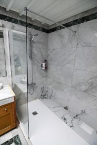 a bathroom with a shower with a glass shower stall at Wonderful House in Atocha in Madrid +40 photos