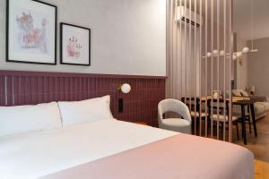 Un ou plusieurs lits dans un hébergement de l'établissement Limehome Sevilla Calle Pureza 39 autres photos