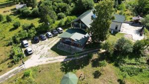 an overhead view of a house with parked cars at La Butuci in Taşca