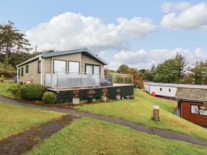 a tiny house on a trailer in a yard at The Hideaway in Afon Wen Junction