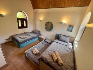 an overhead view of a bedroom with two beds at El Gouna Nubian Lagoonfront Villa - 4BR, 9 Guests in Hurghada +47 photos