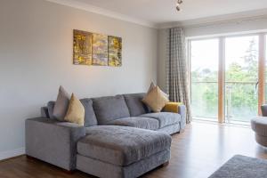 a living room with a couch and a chair at GuestReady - Suburban retreat in Dublin in Mount Merrion +17 photos
