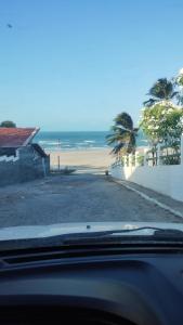 a view of the beach from a car at Pousada Apart Praia Uruaú in Beberibe