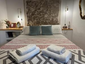 Giường trong phòng chung tại Casa Patio Corduba