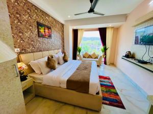 a bedroom with a large bed in a room at Hotel Golden Temple View by la Casa with Swimming Pool in Amritsar