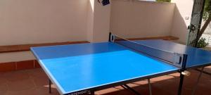 a blue ping pong table in a room at Bilocale - Rosa seaview in villa in Santa Cesarea Terme