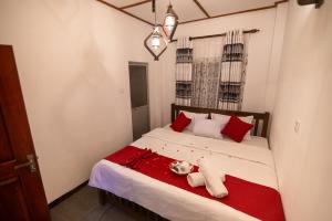 En eller flere senge i et værelse på Selvan Cottage