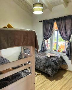 Postel nebo postele na pokoji v ubytování Cabañas Exclusivas en el Corazón de Bariloche