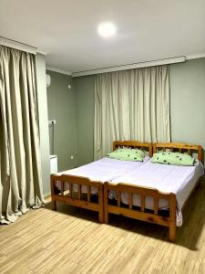 a bedroom with a large bed with white sheets at HOTEL Mare in Ureki