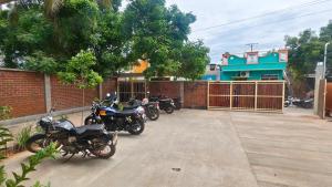 a group of motorcycles parked in a parking lot at Savana Stay in Puducherry