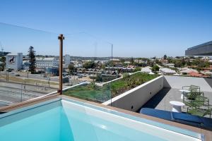 a balcony with a view of a city at Spacious 2-Bed Apartment in North Fremantle in North Fremantle