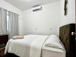 Ένα ή περισσότερα κρεβάτια σε δωμάτιο στο Casa completa em Bragança