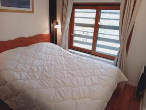 Ένα ή περισσότερα κρεβάτια σε δωμάτιο στο Terrasses E 405 - PARC NAT VANOISE appart 8 pers