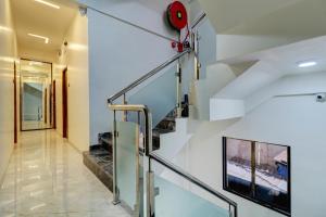 a staircase in a house with a stair case at Krishna Residency in Navi Mumbai