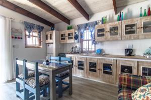 a large kitchen with a table and a counter at Dis Beau-tie-ful in Paternoster
