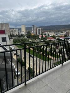 a view of a city from a balcony at Geo House in Tbilisi City