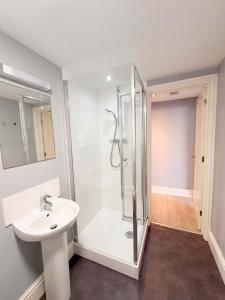 a bathroom with a shower and a sink at Beautiful studio - Whiteladies road in Bristol