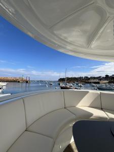 a view of a marina from the back of a boat at ANTHENEA Trebeurden in Trébeurden