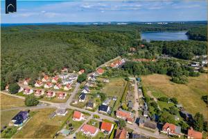 an aerial view of a small town with houses at Waldsiedlung Waldhaus App 2.2 in Korswandt