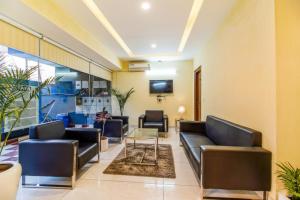 a waiting room with couches and a table at FabHotel Kiara- 400 meters from Medanta hospital in Gurgaon