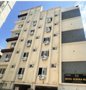 a building with air conditioners on the side of it at Hotel Aurora Bliss in Hyderabad