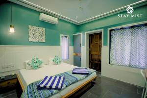 Ένα ή περισσότερα κρεβάτια σε δωμάτιο στο Pearl Castle Villa I Staymist
