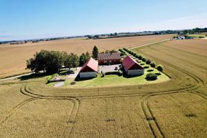 an aerial view of a house in the middle of a field at Solhögs Gård nr 4 in Hammenhög