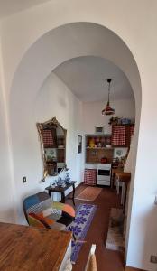 an archway in a living room with a dining room at La Porta Azzurra 