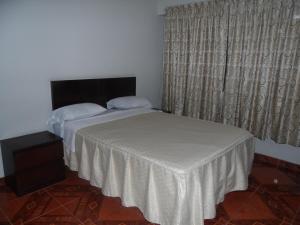 Letto o letti in una camera di Antares Inn