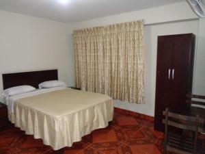 Letto o letti in una camera di Antares Inn