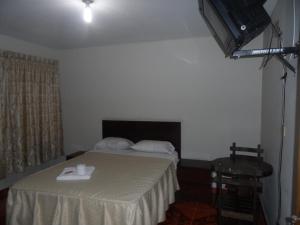 Letto o letti in una camera di Antares Inn