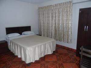 Letto o letti in una camera di Antares Inn