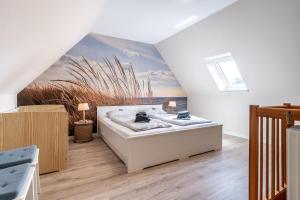 a room with a bed and a painting on the wall at Rungholt in Ording
