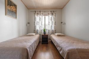 Кровать или кровати в номере Karkutahko Villas 1B - Spacious 3BR Villa in Tahko with Private Sauna