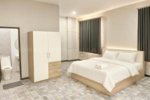 Ένα ή περισσότερα κρεβάτια σε δωμάτιο στο pattaya homely pool villa +7 φωτογραφίες