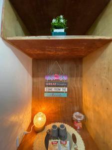 a tiny house with a sign on the wall at Honu Homestay Siargao in Sampong