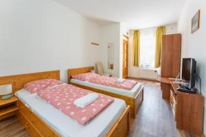 Ένα ή περισσότερα κρεβάτια σε δωμάτιο στο Hársfa Vendégház