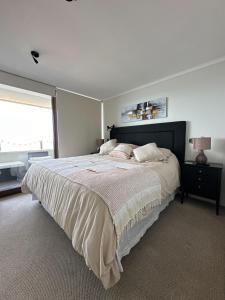 Ένα ή περισσότερα κρεβάτια σε δωμάτιο στο Apartamento vista al Mar a pasos de casino Enjoy +1 φωτογραφίες