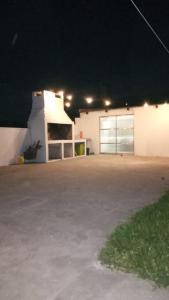 a large parking lot in front of a building at night at La Cautiva 