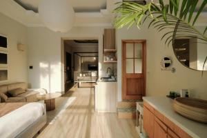 a room with a kitchen and a living room at Atlas Crown Residence-City Centre-Near Street Food Access & Free Laundry in Hanoi