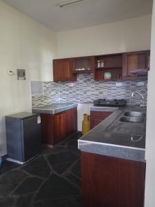 Kuchyň nebo kuchyňský kout v ubytování Golunna Apartment